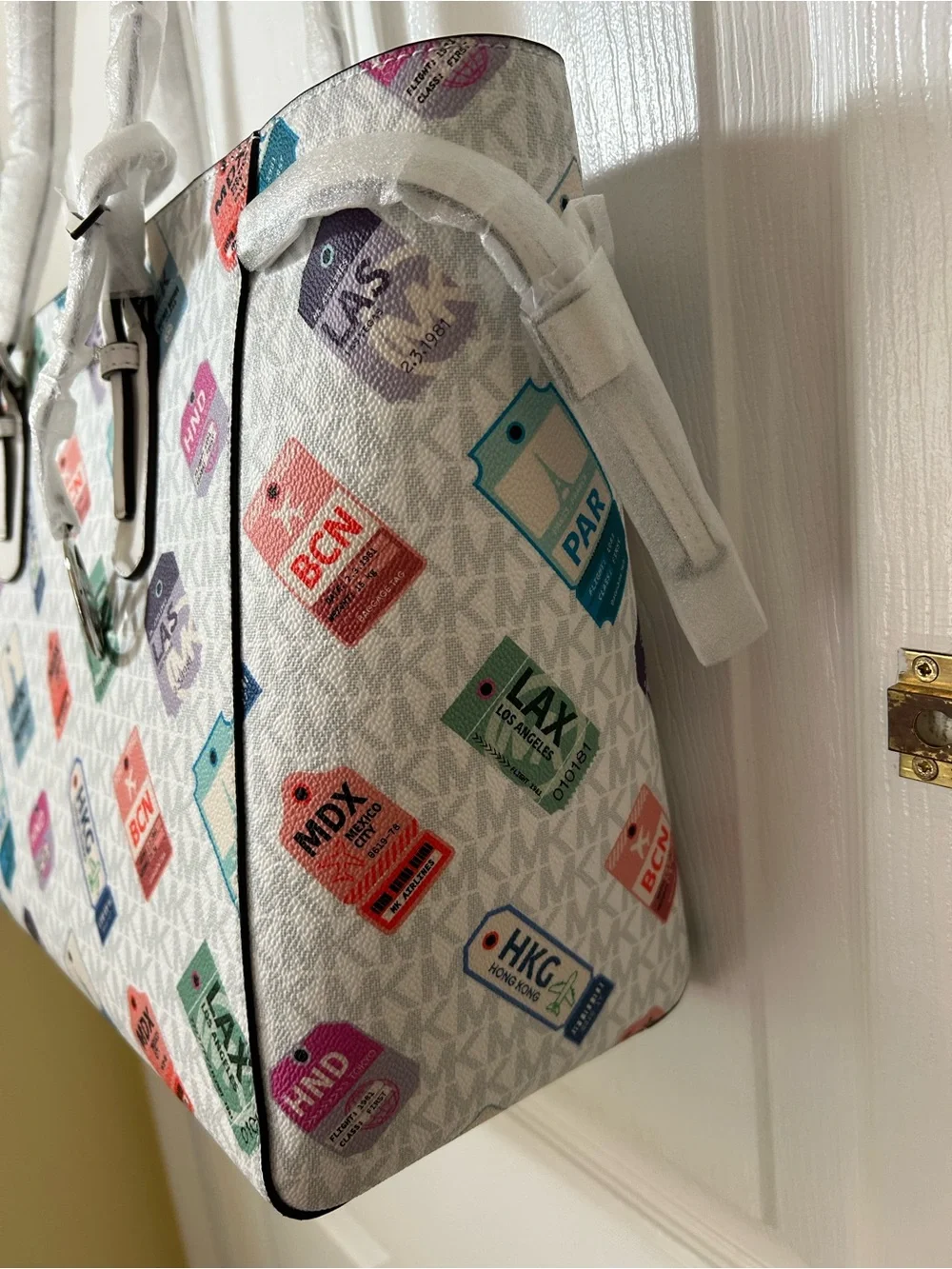 Michael Kors White Tote with Multicolor Luggage Tag Pattern